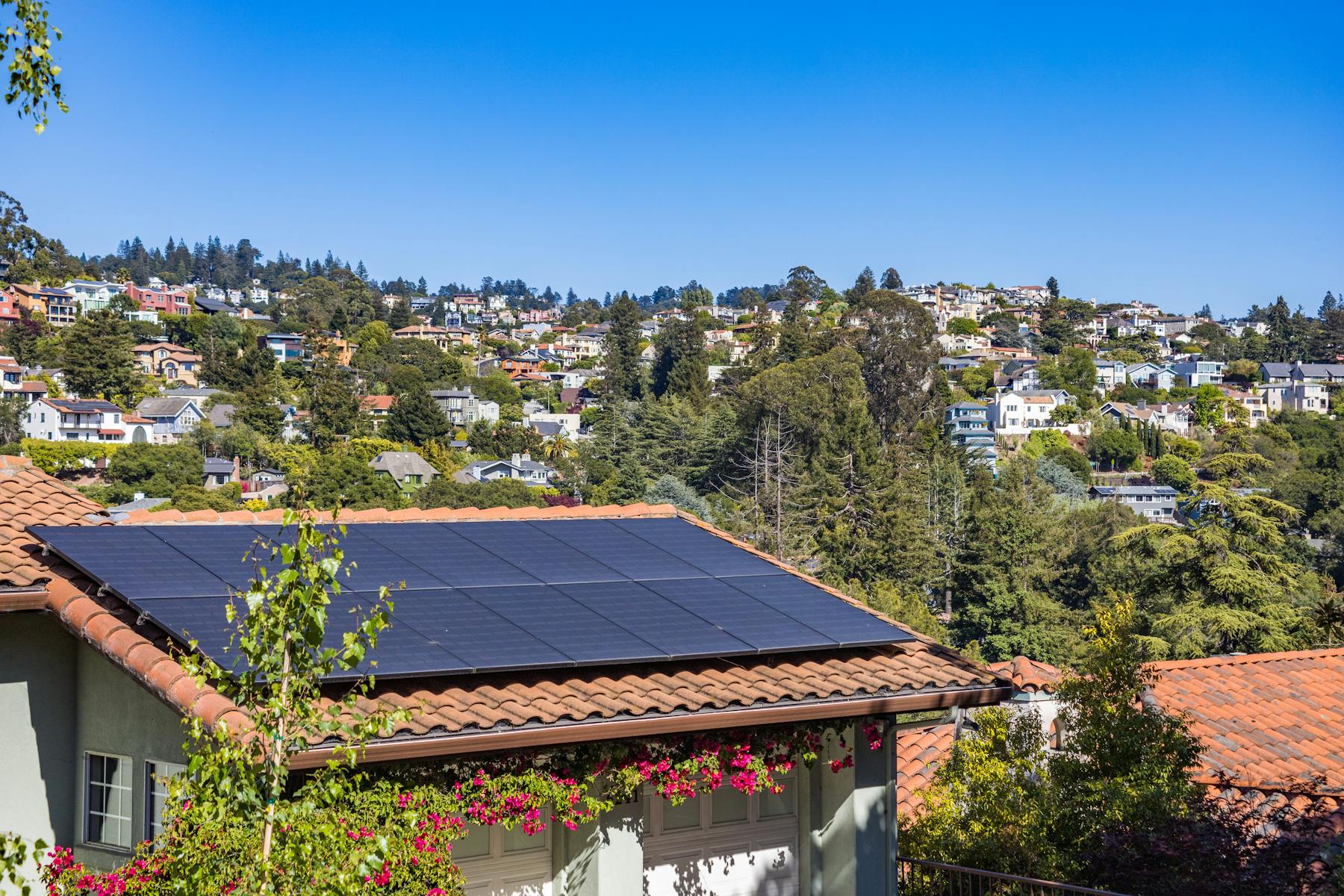 Residential rooftop solar installation under clear daylight
